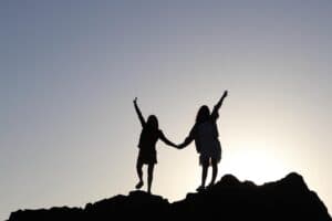 Silhouette of people together at sunset